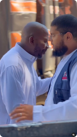 Reeler image of two people greeting each other
